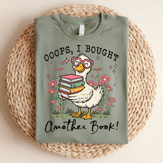 Green t-shirt with a cartoon duck holding books and text on a woven mat